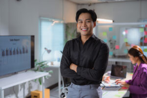 A marketing intern crossing their arms