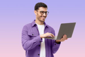 A customer acquisition strategist with a laptop