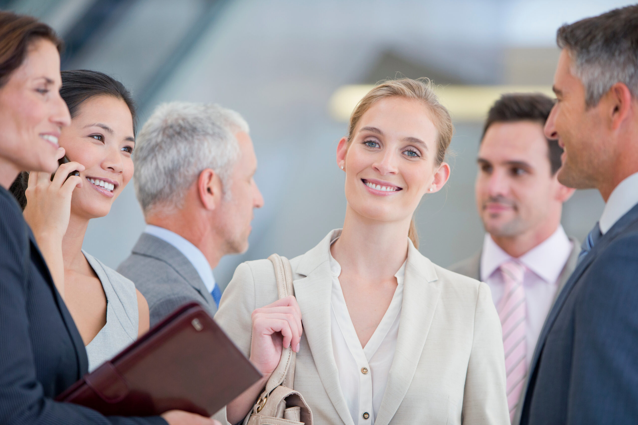 A business consultant surrounded by people