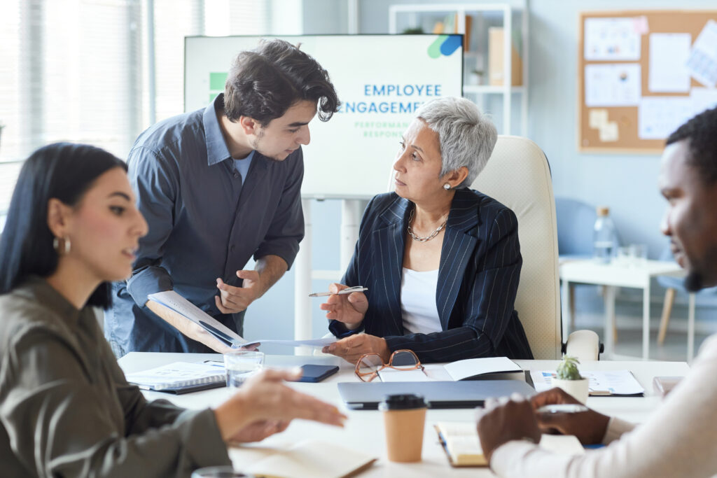 A professional consulting with a senior colleague about a career development plan